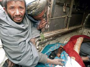 Survivors mourn the deaths of civilians following the massacre in Kandahar