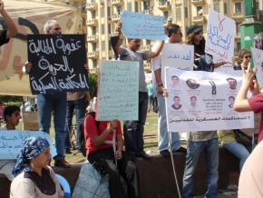 Protesters in Tahrir Square demand an end to the use of military trials against civilians