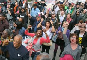 Occupy Wall Street demonstrators march across the Brooklyn Bridge in New York City