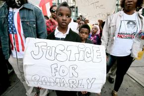 Community members and activists march in the Bronx for justice for Ramarley Graham