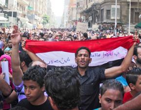 Protesters march from Tahrir Square on the day of the Mubarak verdict
