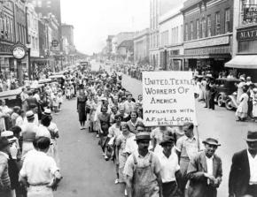 Textile workers on strike parade through Gastonia, N.C.