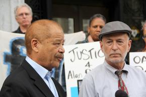 Attorneys Walter Riley (left) and Dan Siegel join activists at a press conference demanding justice for Alan Blueford