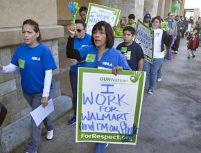 Workers and supporters picket outside a Wal-Mart in Southern California