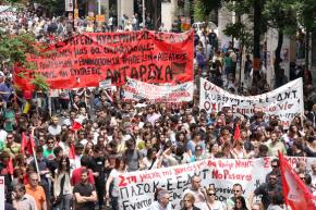Greek workers march in Athens during a general strike against austerity measures