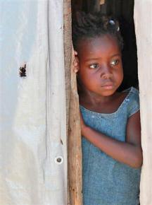 A child still living in a tent city for displaced families in Port-au-Prince
