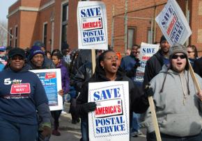 Letter carriers march on Obama's Chicago house to call for his support in stopping the elimination of Saturday service