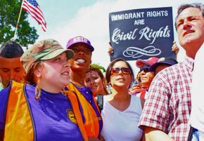 Immigrant rights supporters gather in a mass march on May Day