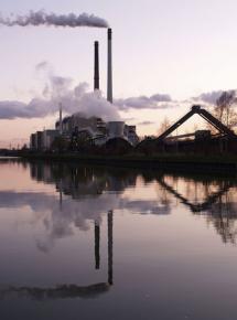 A coal-fired power plant billows smoke
