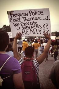 Marching along West Florissant in Ferguson, Mo.