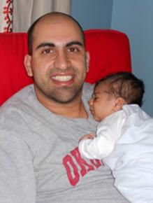 Steven Salaita poses with his child