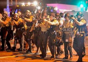 Police on the move during charges against protesters in Ferguson