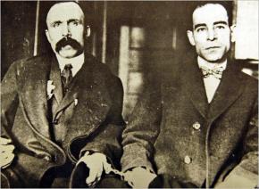 Bartolomeo Vanzetti (left), handcuffed to Nicola Sacco, in the Massachusetts courtroom where they went on trial