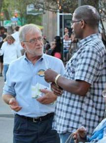 Howie Hawkins talks to a voter in Rochester, N.Y.