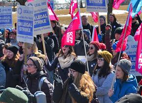 Striking CUPE members, students and faculty rally at the entrance to York University