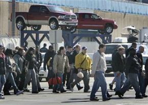 First-shift workers getting off the job at a Chrysler truck assembly plant