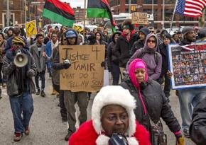 Protesters march for Tamir Rice after a grand jury refused to indict the cop who killed him