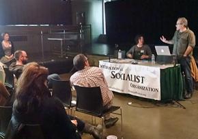 Paul D'Amato (right) speaks at the Socialism in the Air conference in Portland