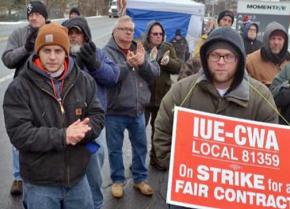 Striking workers at Momentive Performance Materials rally on the picket line