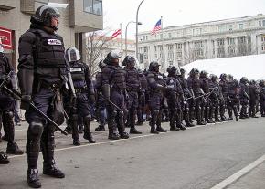 A phalanx of police officers prepares to face down protesters during Trump's inauguration