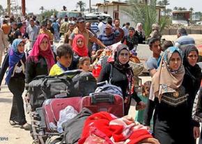 Sunni refugees flee Shia militias near Mosul in Iraq
