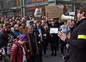 Comcast workers in Philadelphia stage a walkout in opposition to President Trump's Muslim ban