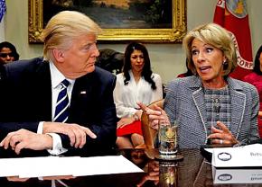 Secretary of Education Betsy DeVos (right) alongside Donald Trump at a White House meeting