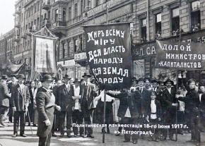 A socialist contingent in Petrograd with banners calling for peace, land and soviet power