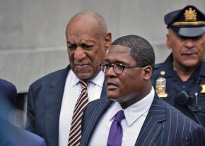 Bill Cosby (left) enters the courthouse