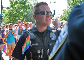 Police officers show support for demonstrators at a pride march in Washington, D.C.