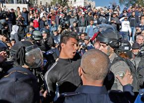 Israeli soldiers arrest Palestinian protesters during mass demonstrations in Jerusalem