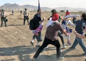 Alt-right thugs attack ant-racists protesting Trump's border wall as the police look on