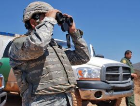 A California National Guard soldier (left) accompanies federal agents patrolling the U.S.-Mexico border