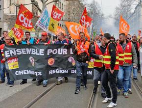 Striking rail workers march through the streets of Lyon, France