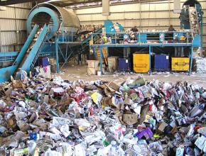 Workers process waste products at a Material Recycling Facility in Australia