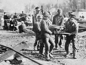 West Virginia coal miners carry the body of a co-worker killed on the job in 1907