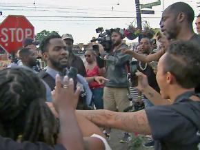 Angry protesters confront Chicago police after another murder of an African American man