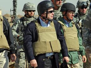 Senator John McCain (center) tours U.S. military installments in Iraq in 2007